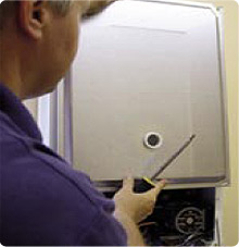 A Safeheat engineer fitting a boiler